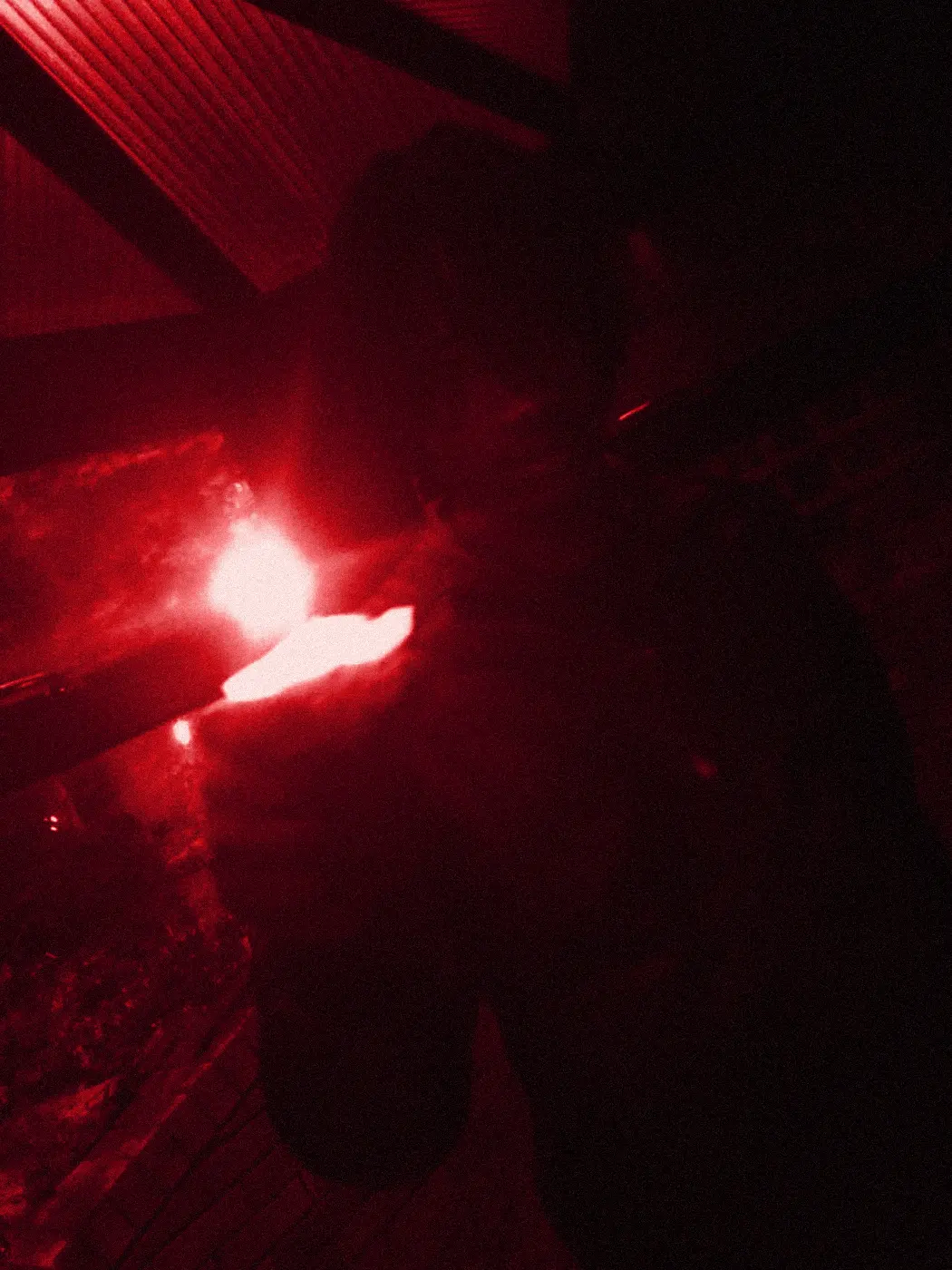 yukan in the dark on the eve of his eighteenth birthday, a flame held out in one hand.